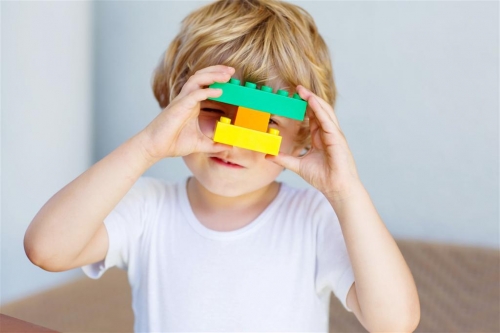 Child with Toy Babies and Childrens programs at Camden Libraries